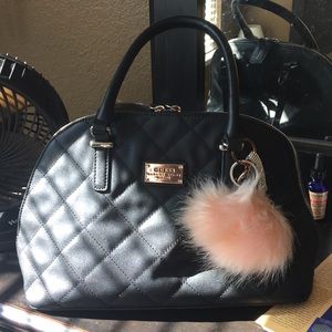 sleek black GUESS handbag
